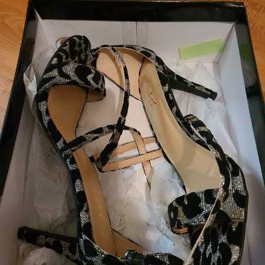 Thalia Sodi black and silver heels