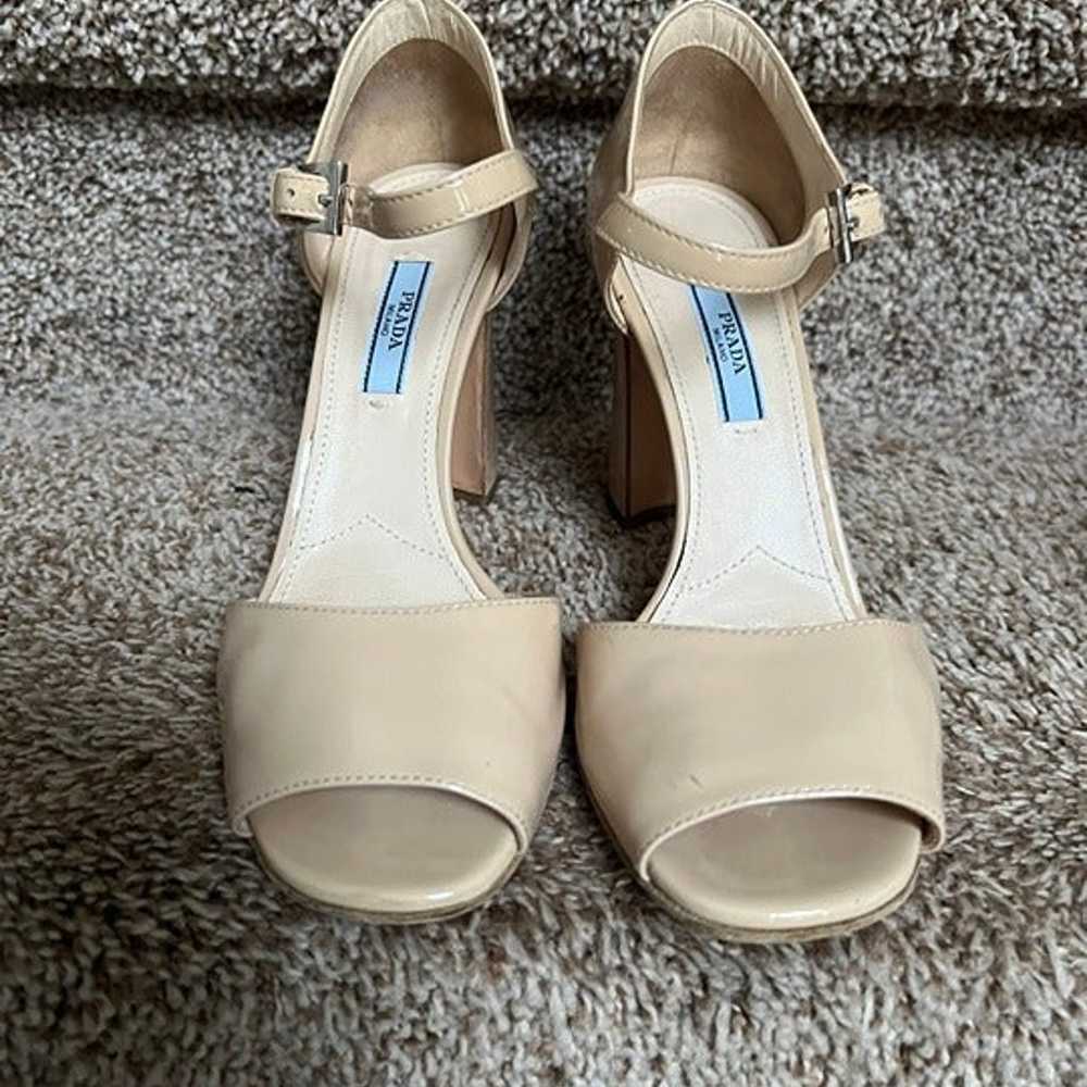 Prada Women's Cream Patent Leather Strap Shoes. - image 1