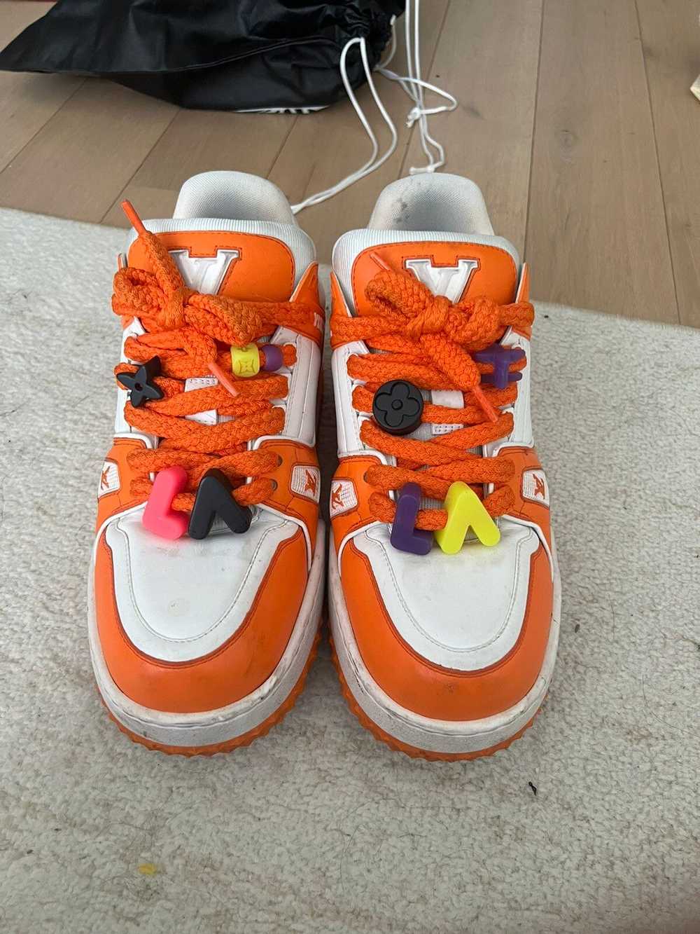 louis vuitton trainers orange mca
