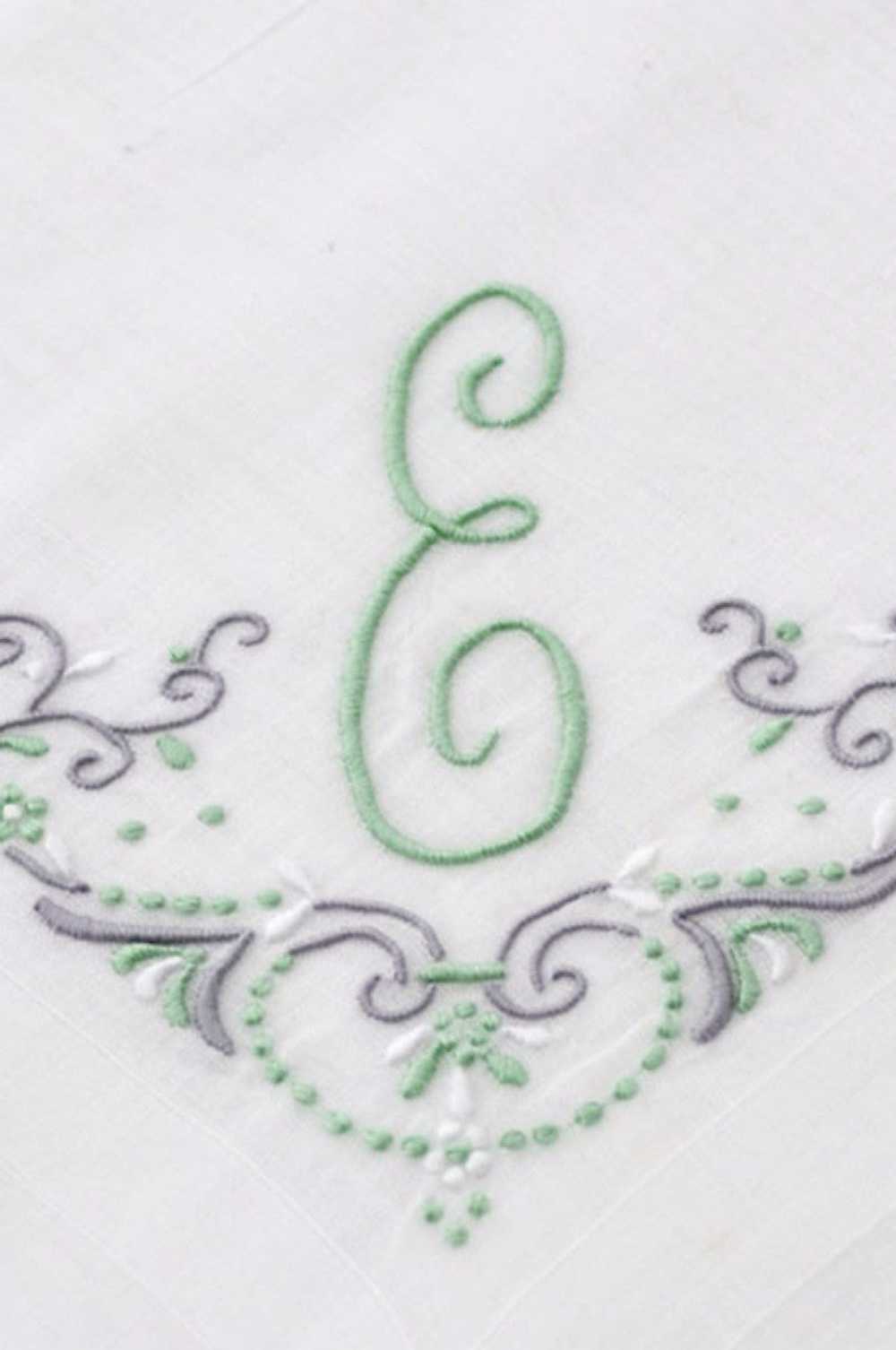 White linen handkerchief with Green E monogram an… - image 1