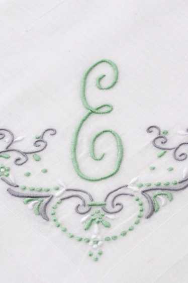 White linen handkerchief with Green E monogram and