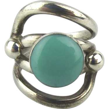 Sterling Silver Ring Hugs Around Turquoise Stone - image 1