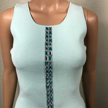Light blue sleeveless knit top with aqua blue and 