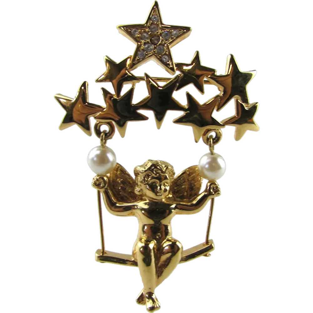 Cherub in Gold Tone Swinging On a Group of Stars - image 1