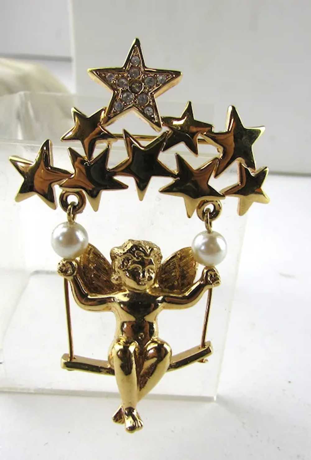 Cherub in Gold Tone Swinging On a Group of Stars - image 3