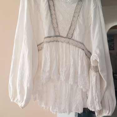 Free people distressed bottom white oversized top.