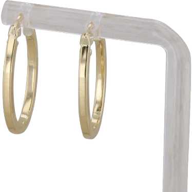 14k Yellow Gold Oval Textured and Polished Hoop Ea