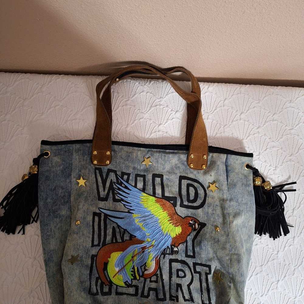 Stonewashed denim hobo bag with embroidered parrot - image 3