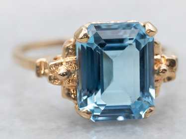 Yellow Gold Blue Topaz Solitaire Ring - image 1