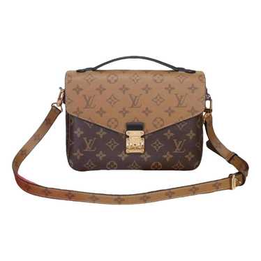 Louis Vuitton Metis cloth clutch bag