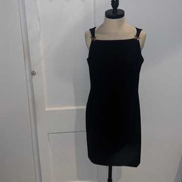 CDC black sleeveless sheath dress
