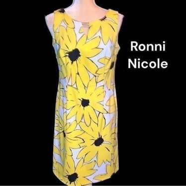 Ronni Nicole beautiful white dress with bold yello