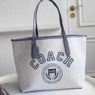 Coach City Tote In Signature Canvas With Varsity M