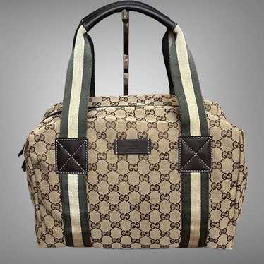A12-  Gucci small duffel bag