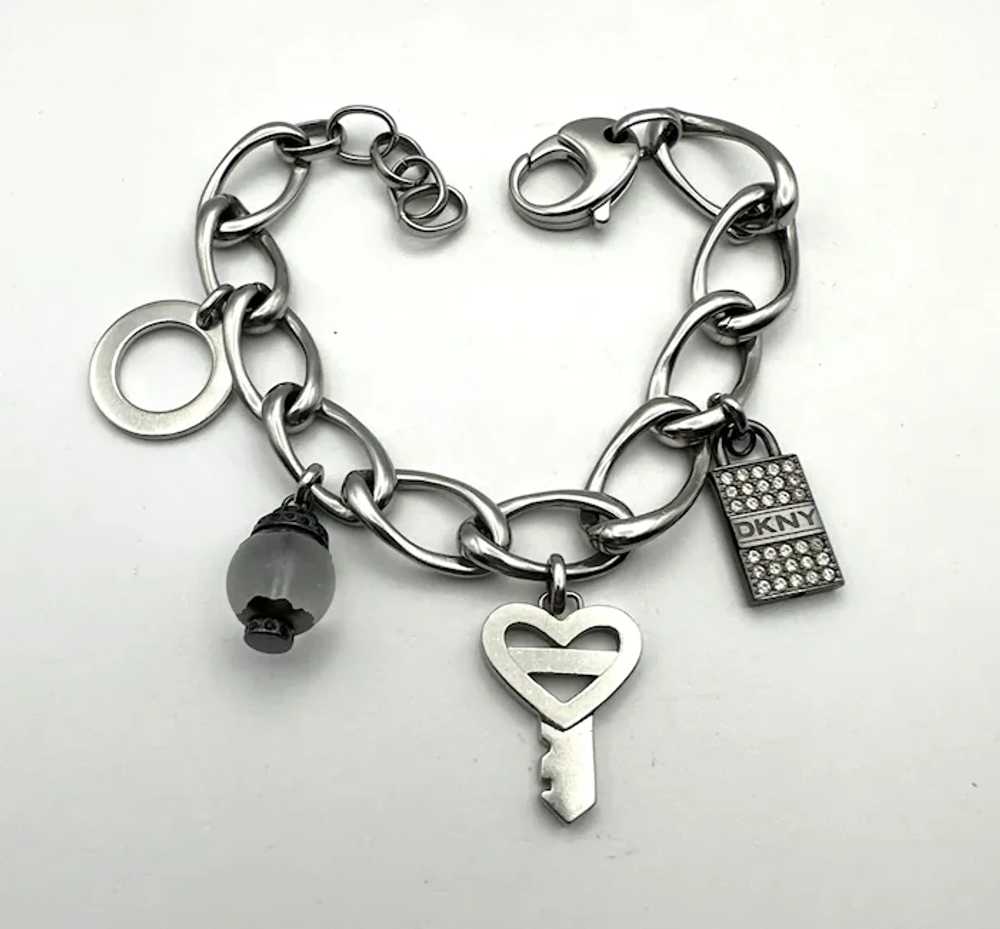 DKNY signed Key to My Heart Silvertone Charm Brac… - image 12