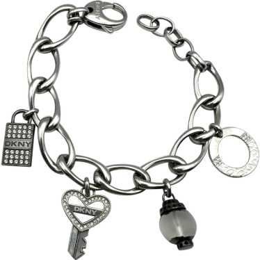 DKNY signed Key to My Heart Silvertone Charm Brac… - image 1