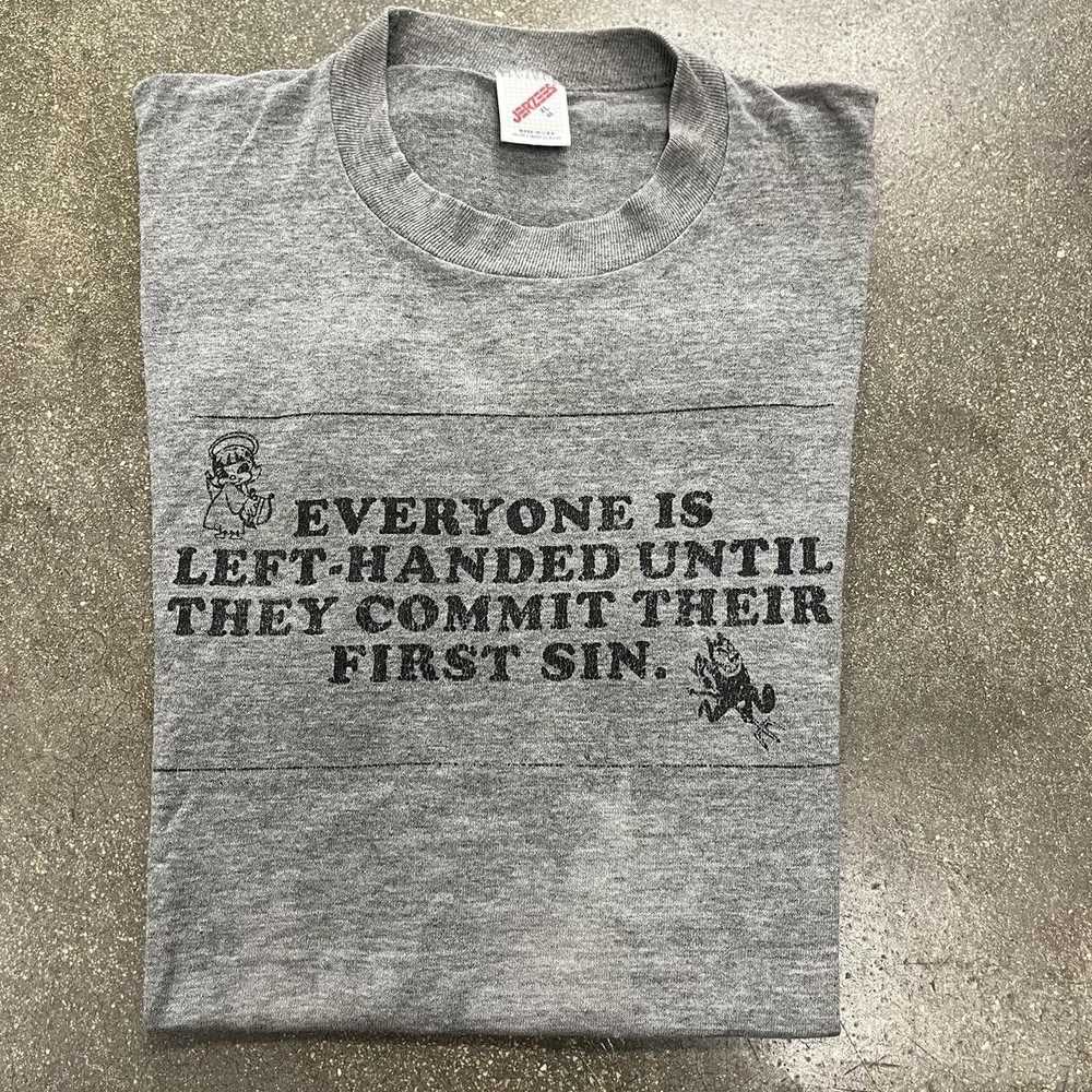 Vintage 80s "Everyone is Left Handed Until Sin" T… - image 1