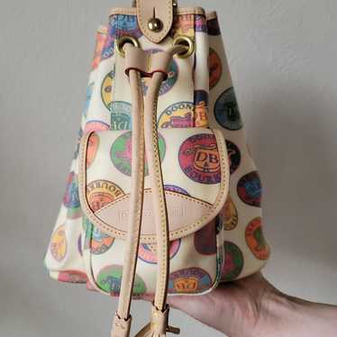 Vintage Dooney And Bourke Medallion Sling Bag - image 1