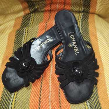 Chanel Camelia flower black leather sandals.