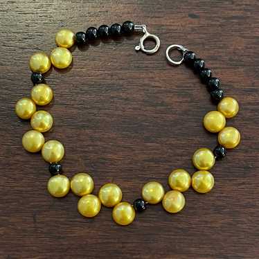 Cultured freshwater golden button pearl black ony… - image 1