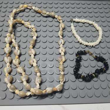 3 shell pieces, 1 long necklace and 2 bracelets. - image 1