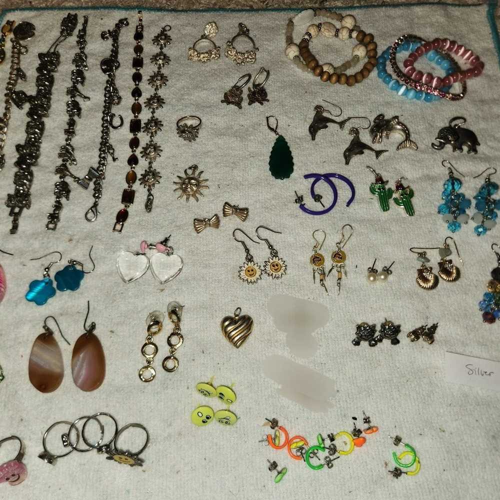 Lot of 50+ fashion earrings, bracelets and rings - image 1