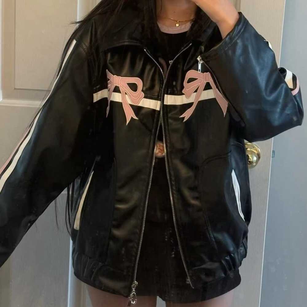 Black and pink leather jacket with a bow detail - image 2