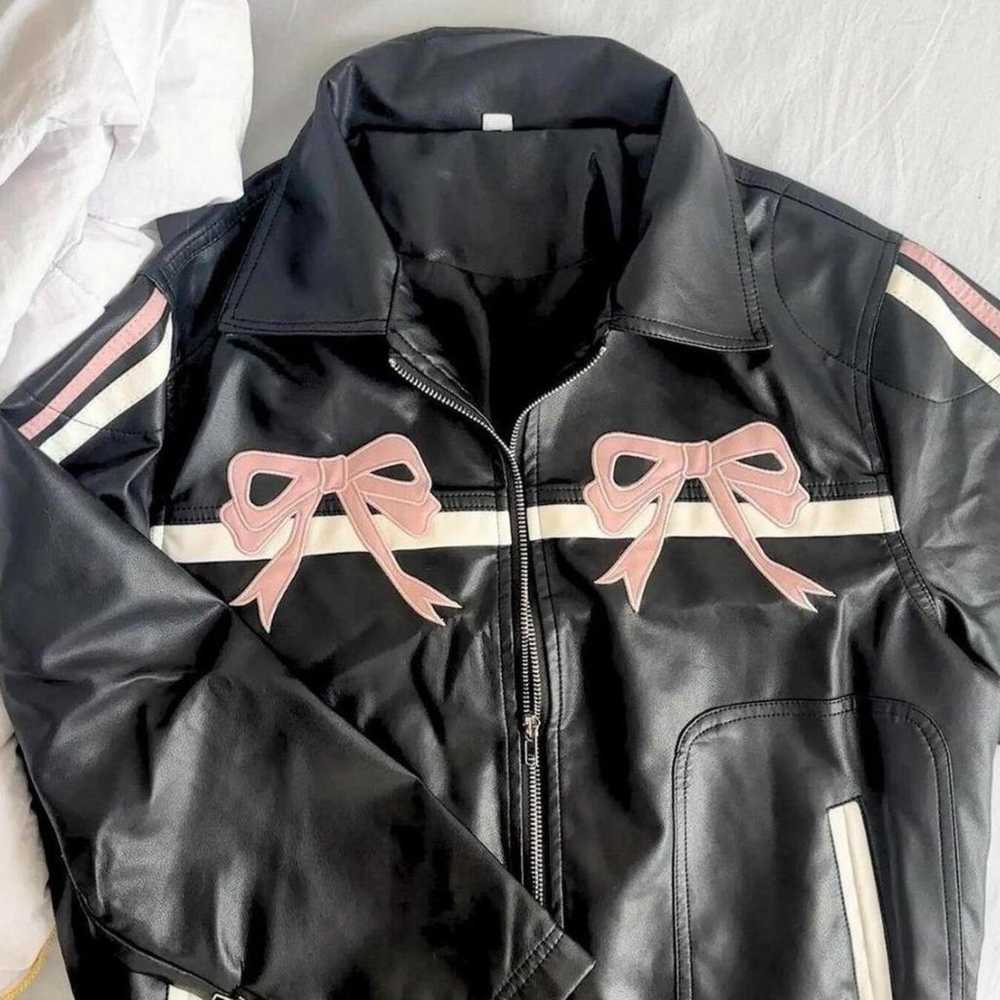 Black and pink leather jacket with a bow detail - image 3