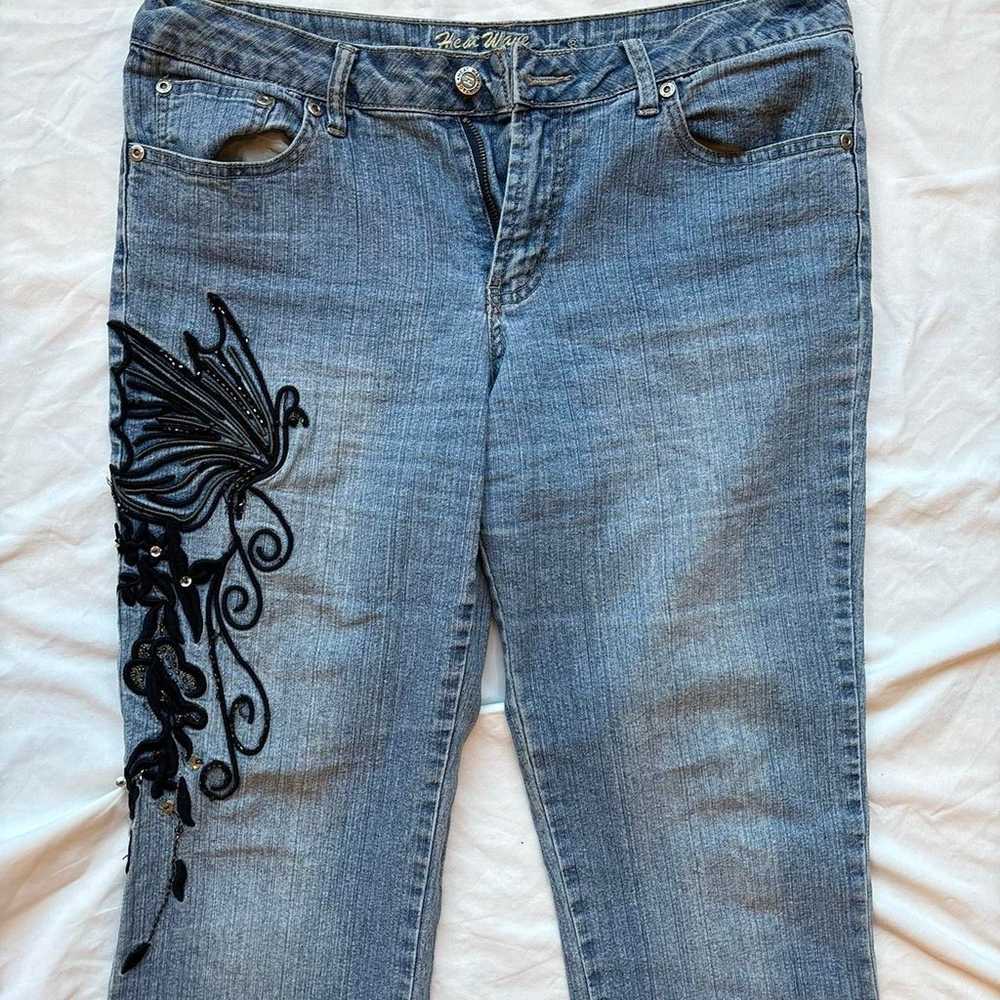 Blue and black butterfly embroidered jeans with a… - image 1