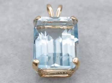 Blue Topaz Solitaire Pendant in Yellow Gold - image 1