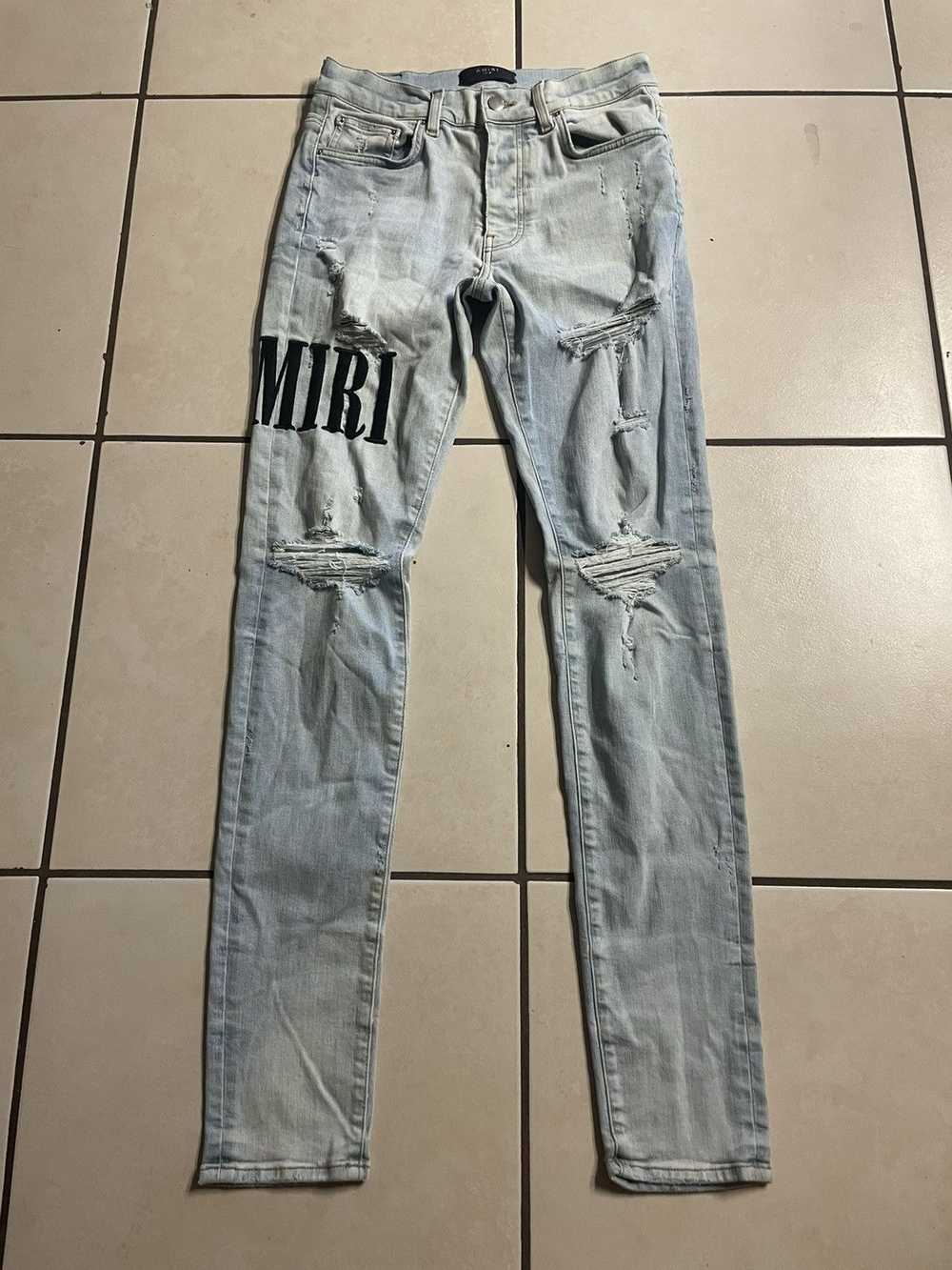 Amiri Amiri Logo Distressed Skinny Jeans - image 1