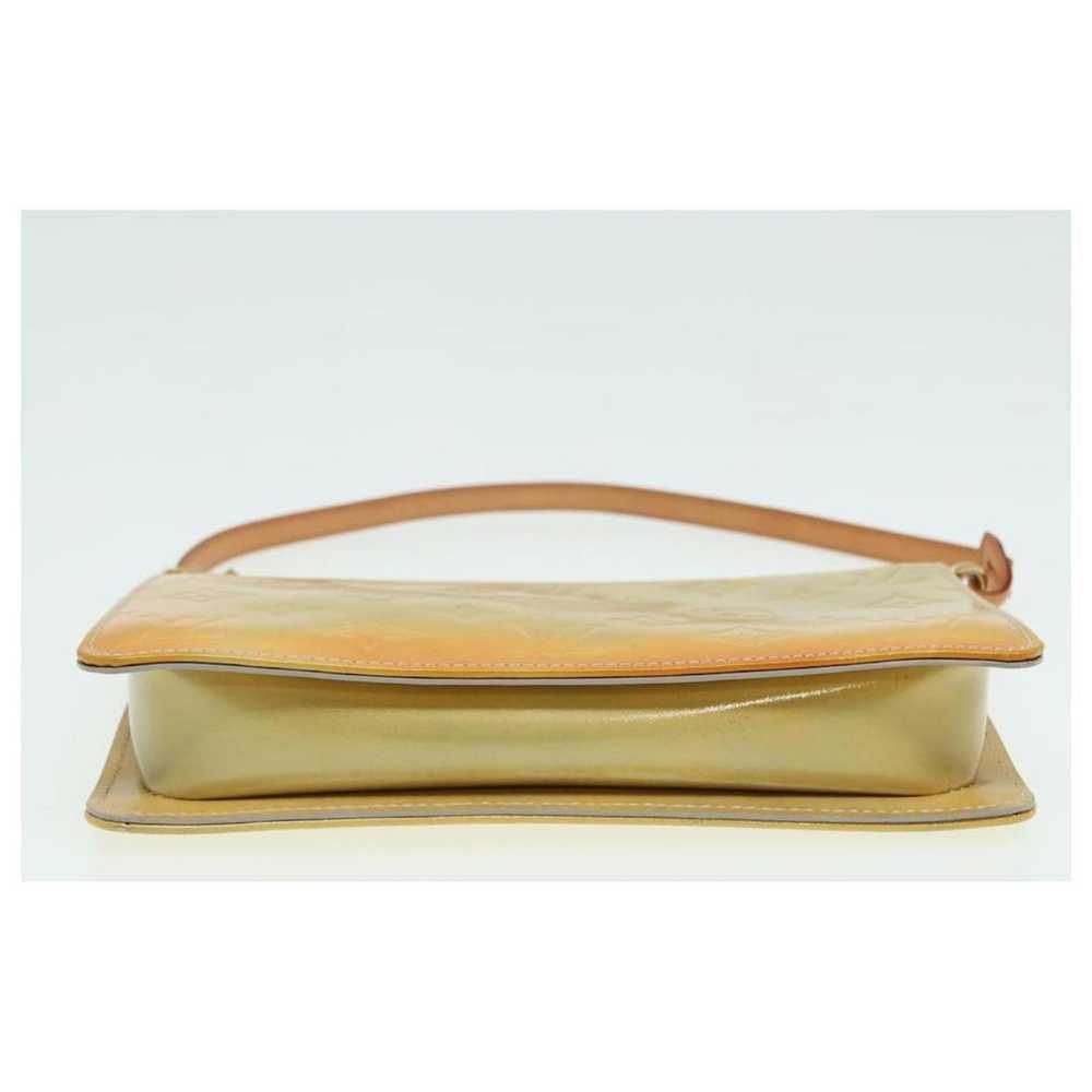 Louis Vuitton Lexington leather clutch bag - image 4