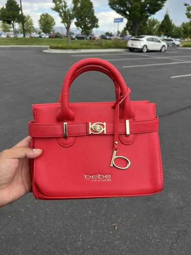 Bebe Bebe red and gold handbag