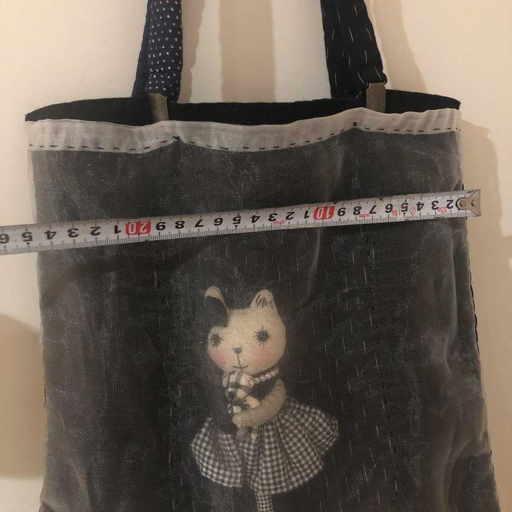 Bag with a cat doll inside - image 2