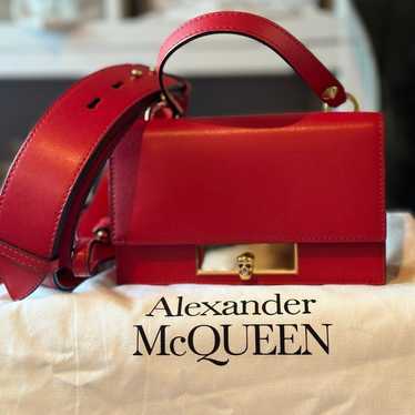 Alexander McQueen boxy silhouette red bag.