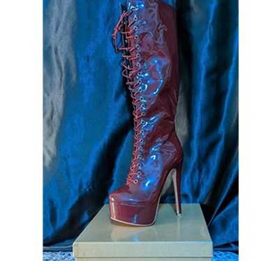 Red knee high high heel boots