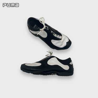 PUMA golf shoes in white and black.