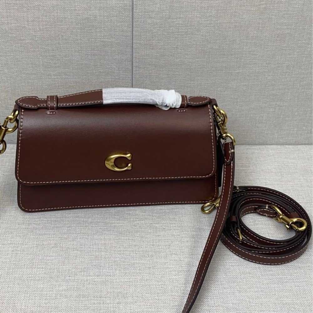 Coach shoulder bag in brown with C-tag attached. - image 1