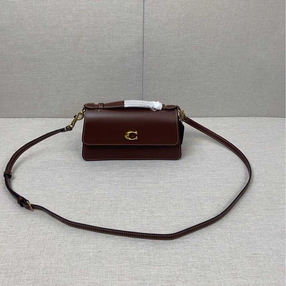 Coach shoulder bag in brown with C-tag attached. - image 4