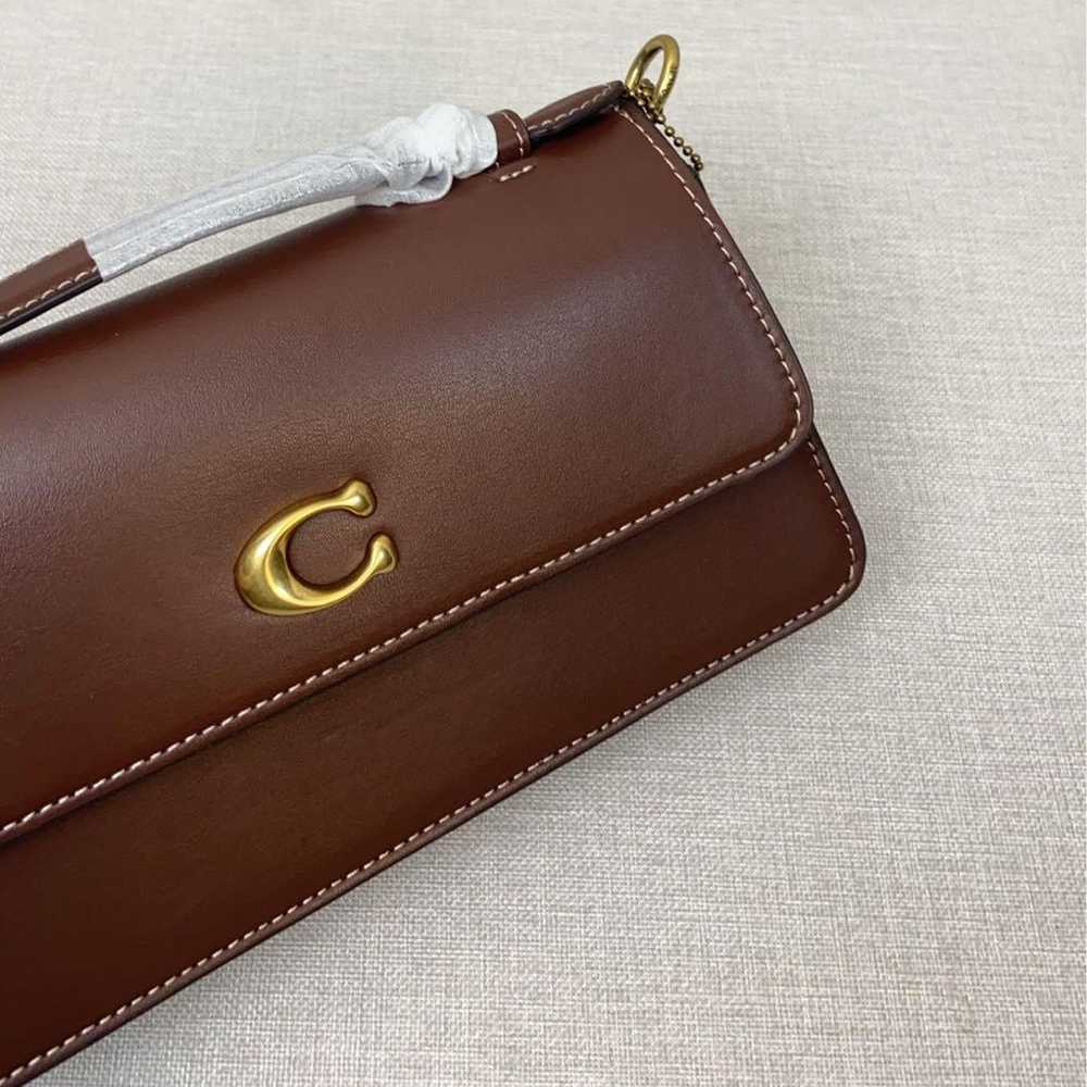 Coach shoulder bag in brown with C-tag attached. - image 6