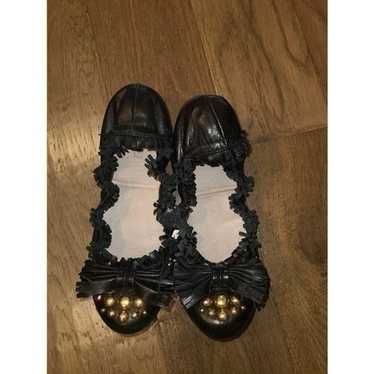 Miu Miu  black and gold studded bow flats