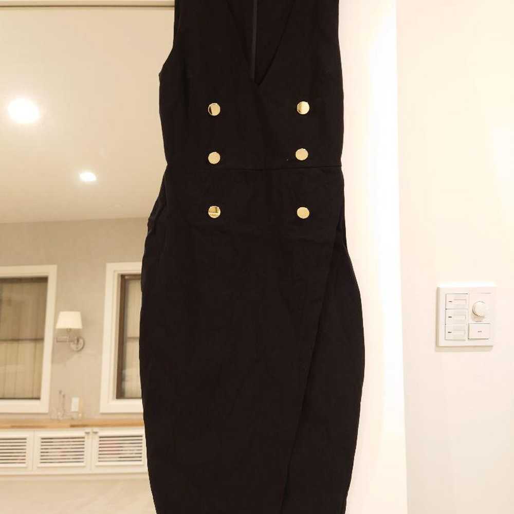 Black sleeveless one-piece dress, knee length wit… - image 1