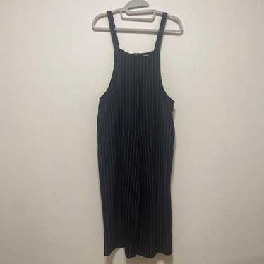 Black and white striped sleeveless jumpsuit.