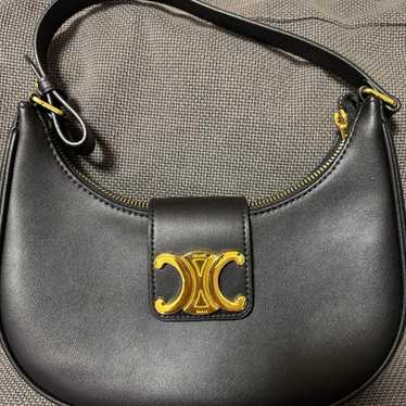 Black leather shoulder bag.