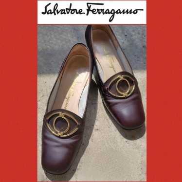 Salvatore Ferragamo pumps in brown.