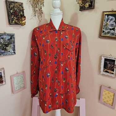 A lovely retro blouse with a design of skiing in S