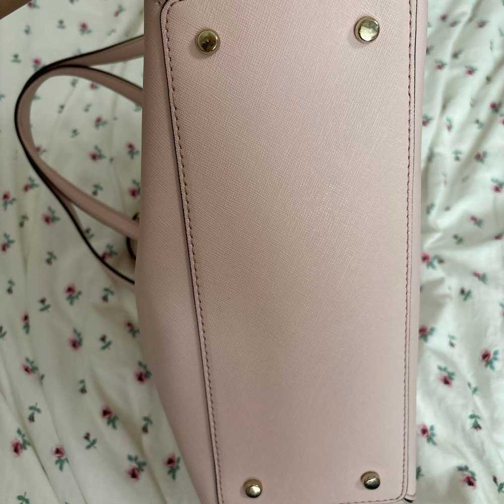 Kate Spade's pastel pink bag. - image 6