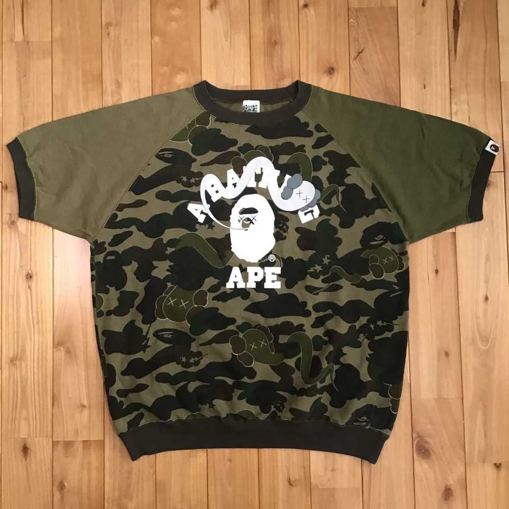 Bape × Kaws KAWS × BAPE camo bendy sweat shirt a … - image 1