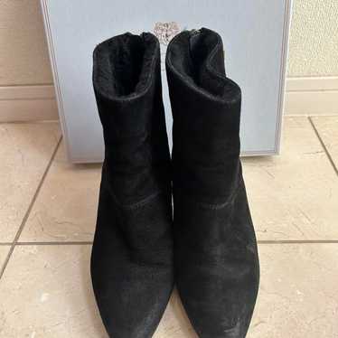 BRUNOMAGLI's black suede boots.