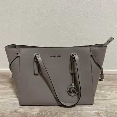 MICHAEL KORS gray business bag.